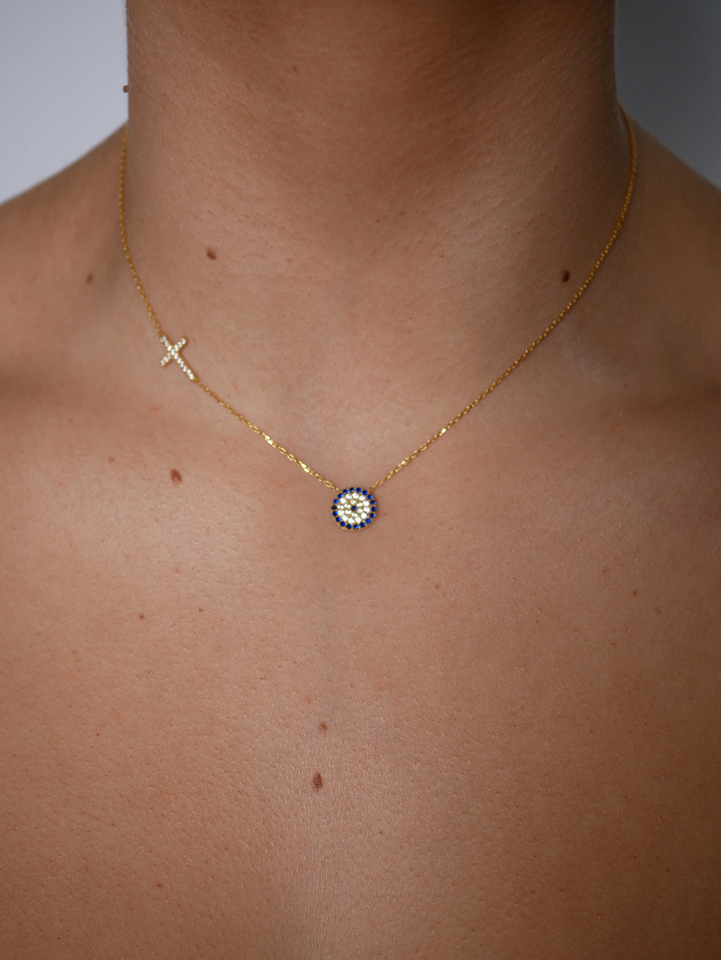 Claudia Evil Eye Side Cross Necklace